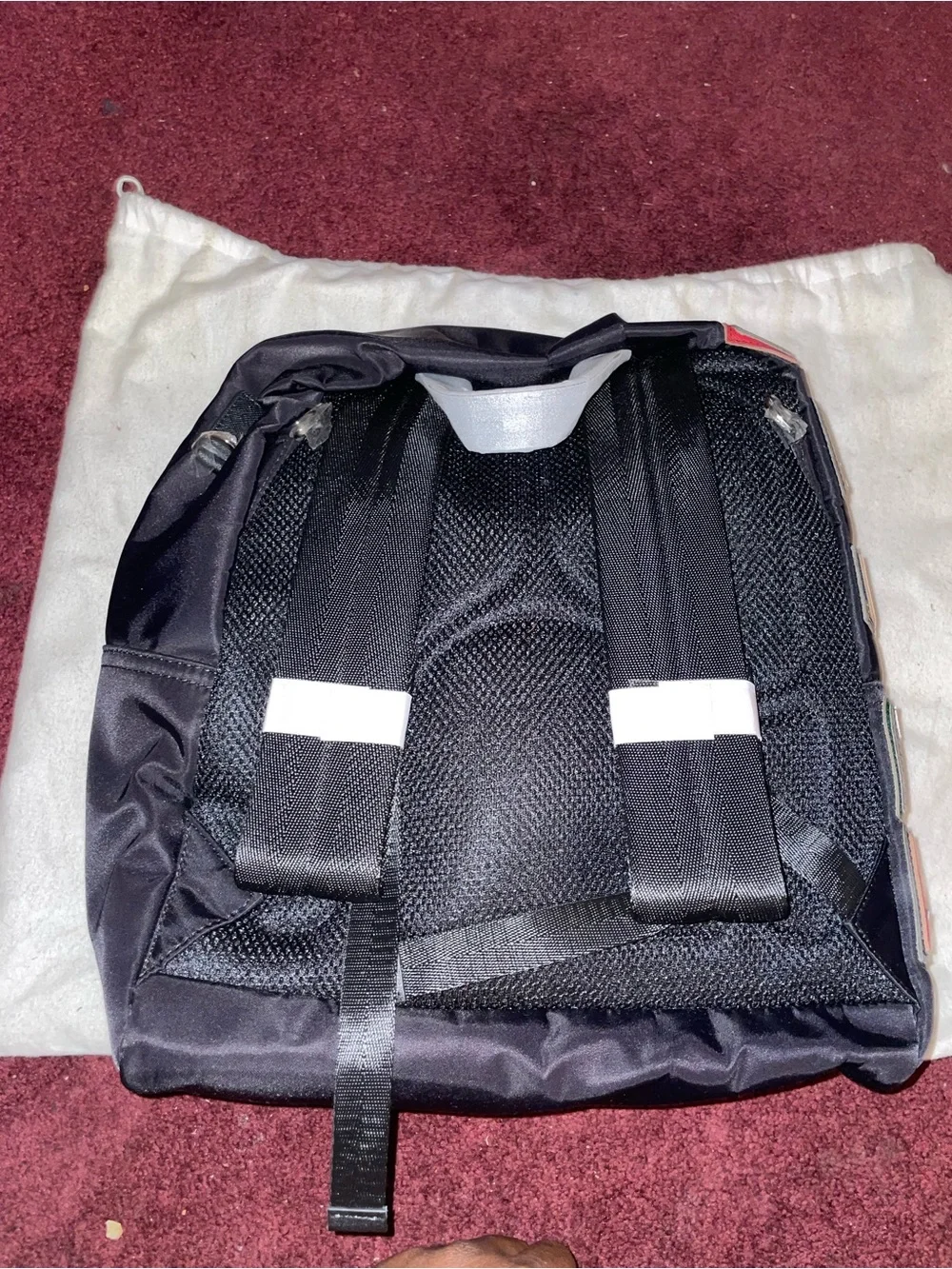 Prada Men’s Black Nylon Backpack with Multicolor Letter Patches